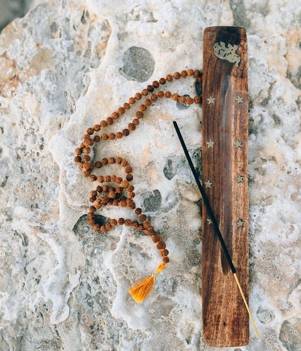 Silhouette of a person breathing deeply against a calm background.